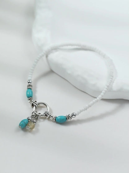 Maëlys | Cheville turquoise à pampilles