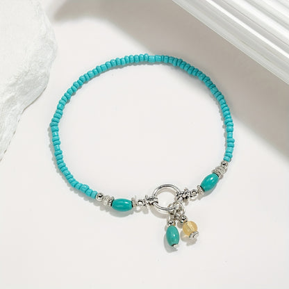 Maëlys | Cheville turquoise à pampilles
